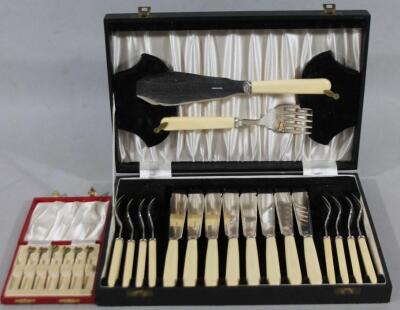 A cased set of six silver gilt and part enamel tooth picks