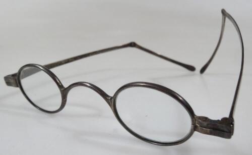 A pair of early 20thC silver framed spectacles