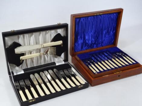 An Edwardian silver entrée knife and fork set