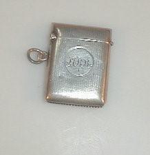 A George V silver vesta case engraved with a monogram