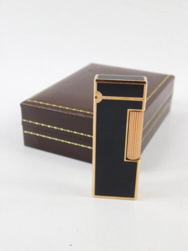 A Dunhill gold plated and black enamel Rollalite pocket lighter