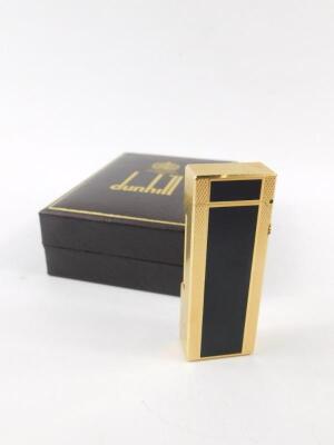 A Dunhill gold plated and black enamel Rollalite pocket lighter