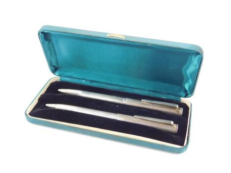 A Dunhill silver plated ballpoint pen and propelling pencil set