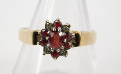 A 9ct gold garnet and diamond ring