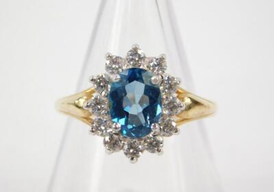 A 9ct gold and blue topaz and cubic zirconia ring