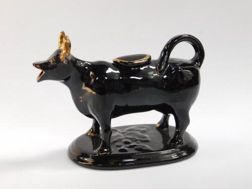 A Jackfield 19thC black and gilt cow creamer