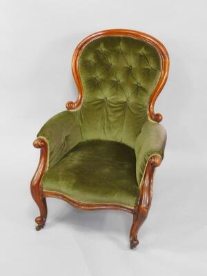 A Victorian mahogany spoon back armchair