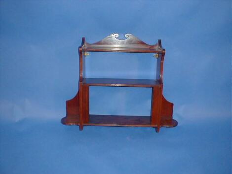 A Victorian walnut hanging wall shelf