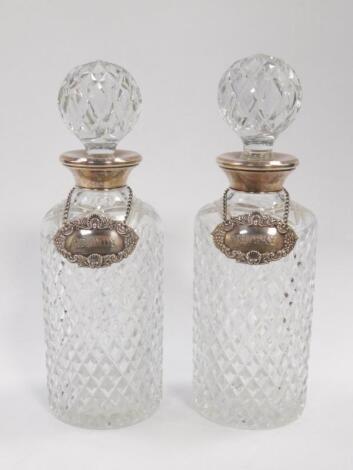 A pair of cut glass decanters and stoppers