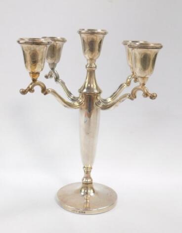 A silver five branch candelabrum