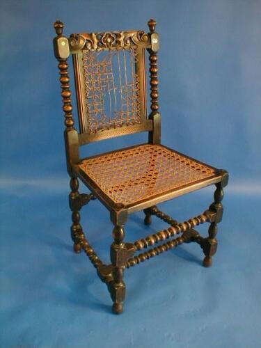 A set of four Jacobean style bobbin turned chairs with caned seats and backs