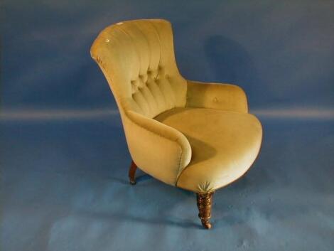 A Victorian oak framed nursing chair with green button velvet upholstery