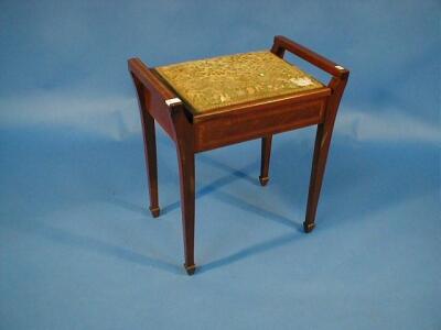 An Edwardian string inlaid mahogany piano stool