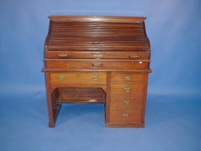 An Edwardian walnut roll top desk with S-shape tambour