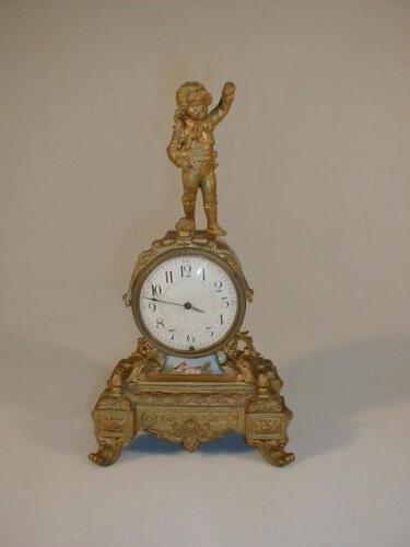 A 19thC French gilt metal figural table clock