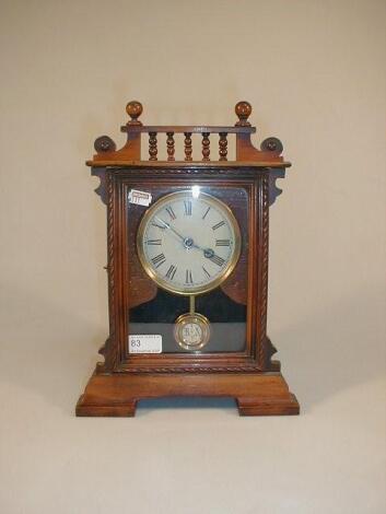 A Victorian walnut mantel clock