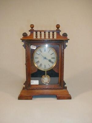 A Victorian walnut mantel clock