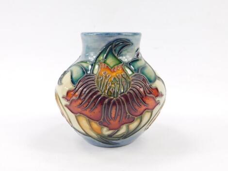 A Moorcroft Pottery vase decorated in the Honeysuckle pattern