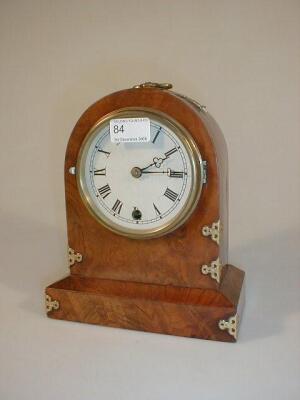 A Victorian figured walnut mantel clock