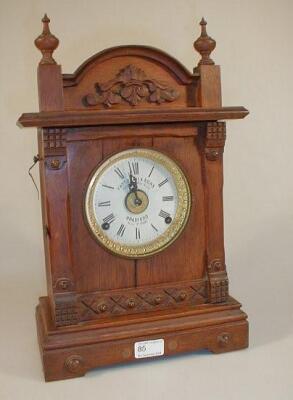 A 19thC Fattorini & Sons patent automatic alarm shelf clock