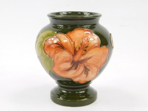 A Moorcroft Pottery vase decorated in the Hibiscus pattern