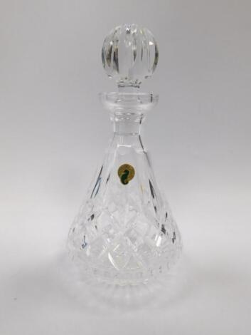 A Waterford cut glass decanter and stopper decorated in the Lismore pattern