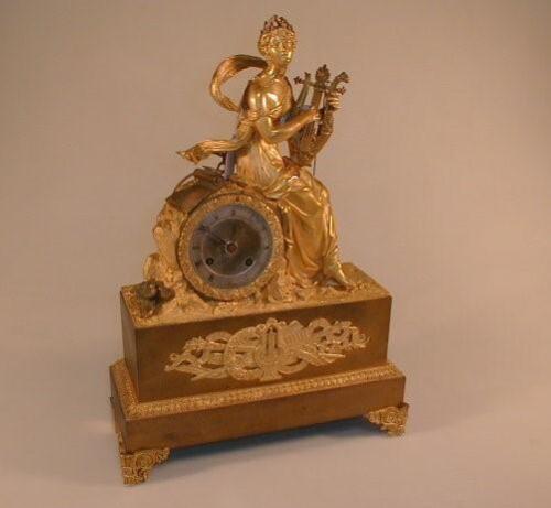 A 19thC French gilt metal mantel clock of eight day bell striking movement