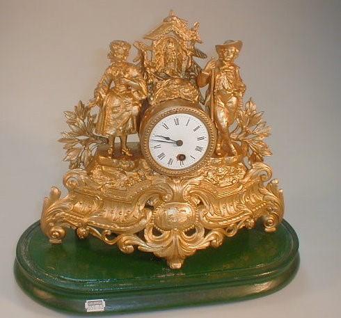 A 19thC French gilt spelter mantel clock with a timepiece movement