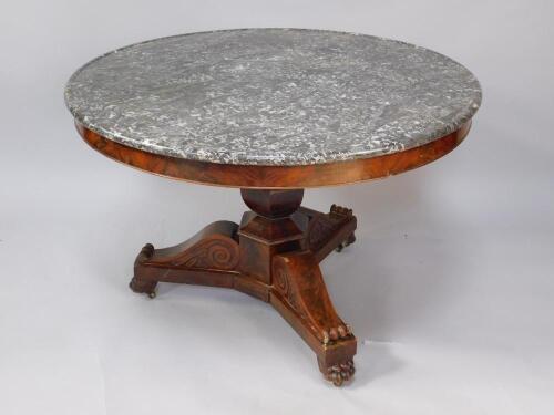 A Regency mahogany and marble topped circular library table