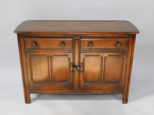 An Ercol oak sideboard