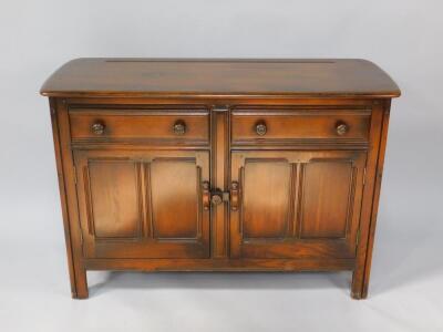 An Ercol oak sideboard