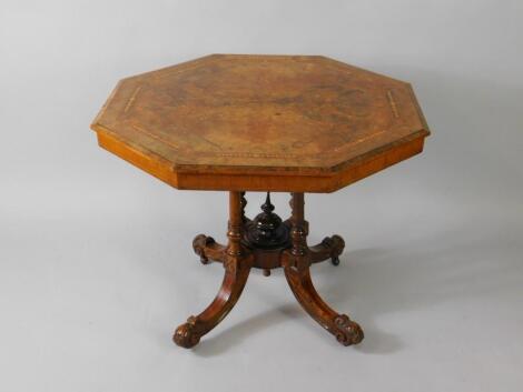 A Victorian walnut octagonal tilt top occasional table