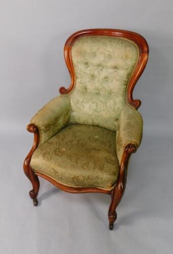 A Victorian mahogany balloon back armchair