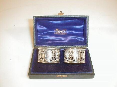 A pair of pierced silver napkin rings by Hilliard & Thomason