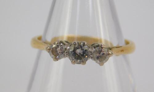 An 18ct gold and diamond three stone ring