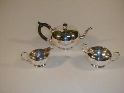 A George V silver three-piece tea service by Edward Barnard