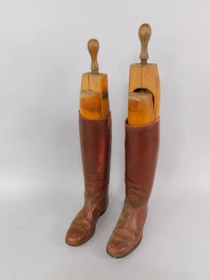 A pair of tan leather riding boots