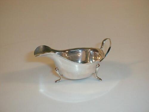 A George V silver sauce boat by Viners