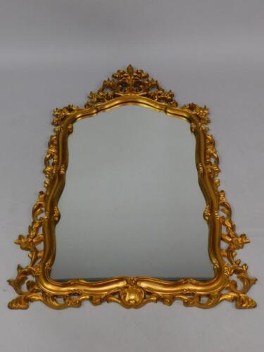 A rococo style gilt wall mirror