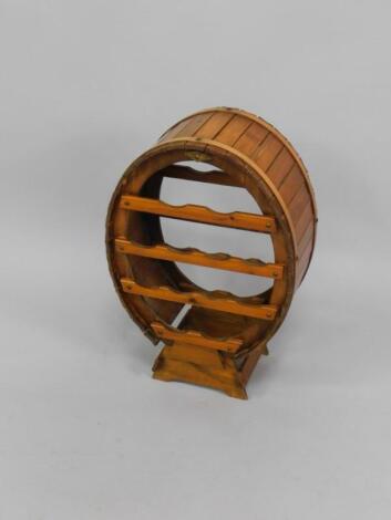 An oval pine Cooper's style wine rack