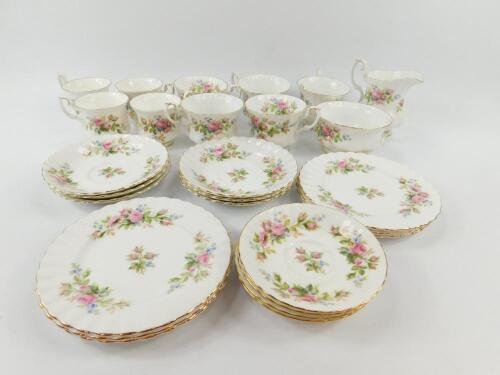 A Royal Albert porcelain part tea and coffee service decorated in the Moss Rose pattern