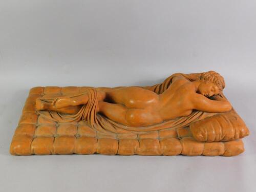 A terracotta late 19thC study of a reclining nude