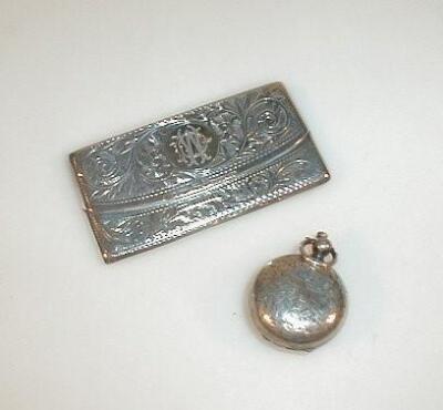 An Edwardian silver stamp case with spring lid