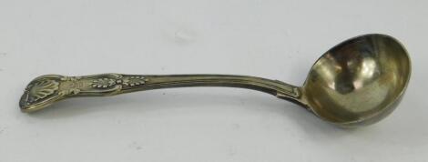 A Victorian silver cream ladle decorated in the Kings pattern