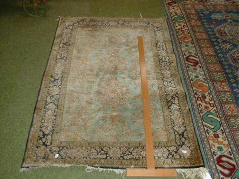 A blue ground Persian design rug