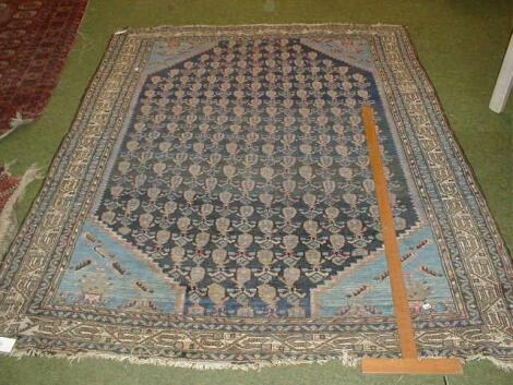 A Turkish design blue ground multi gull rug