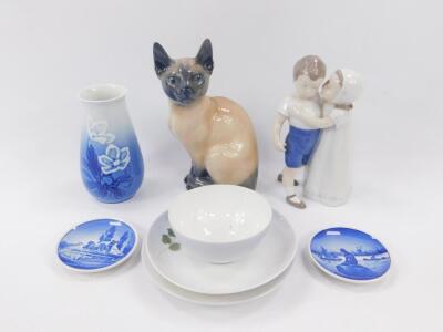 A Royal Copenhagen porcelain figure modelled as a Siamese Cat