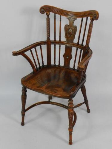 A Regency influence oak and elm Windsor chair