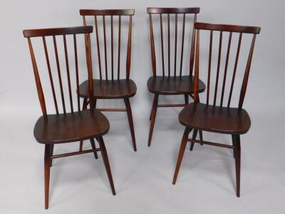 A set of four Ercol oak and elm kitchen chairs.