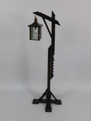 An oak lantern formed standard lamp